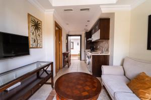a living room with a couch and a table at GAV Ciudad in Ronda