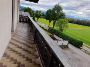 a balcony of a building with a view of a field at Margarethner Appartments in Sankt Margarethen bei Knittelfeld