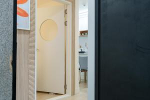 a room with a black door and a mirror at 포레스트101 in Seoul +70 photos