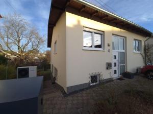 a small house with a window on the side of it at Ferienwohnung Annenblick in Sankt Wendel