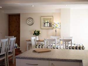 a kitchen and dining room with a table and chairs at Whitehouse Farm in Hartington