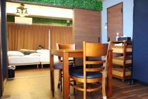 Llit o llits en una habitació de MISUZUbuilding 56 fotos més