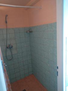 a bathroom with a shower with blue tiles at Chata Jablunka, Dog friendly, 50m ski slope, 50m restaurant in Pec pod Sněžkou