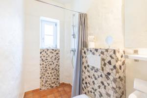 a bathroom with a shower with a shower curtain at Lodge an der Muehle in Bredstedt +33 photos