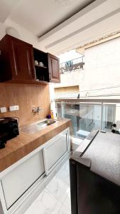 a kitchen with a sink and a counter top at Résidence Luxury in Abidjan +25 photos