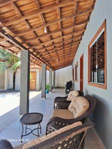 a living room with a couch and a table at Casa em Prado bahia in Prado