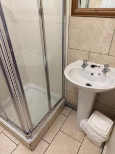 a bathroom with a shower and a sink at Wentworth arms in Malton +17 photos