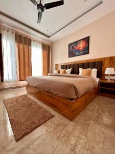 a bedroom with a large bed in a room at Namaste Hostel Rishikesh in Rishīkesh