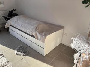 a bedroom with a bed with a white bed frame at Idyllisches Kleinod in Gerolzhofen