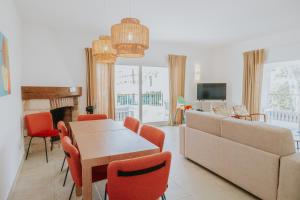 a living room with a couch and a table and chairs at Villa Santo Tomas - Gabriela in Santo Tomás