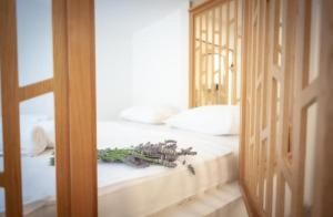 a bedroom with a bed and a door with a mirror at Blue Bay Apartment Piran in Piran