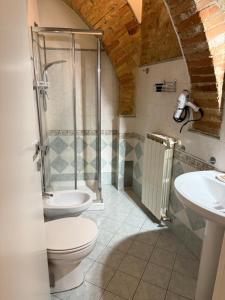 a bathroom with a shower and a toilet and a sink at Dimora dei cesari in Città di Castello +20 photos