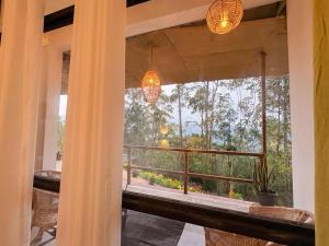 a view of a balcony from a house with a window at Tea Ridge Ella by SANS in Ella