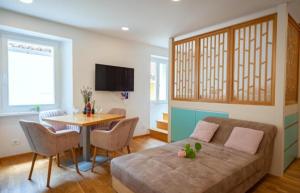 a living room with a couch and a table at Blue Bay Apartment Piran in Piran