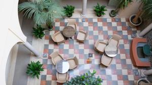 an overhead view of a patio with tables and chairs at Casa Romana Hotel Boutique in Seville +69 photos