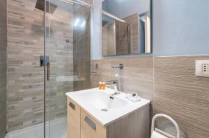 a bathroom with a sink and a shower at Casacecilia relax in Syracuse +48 photos