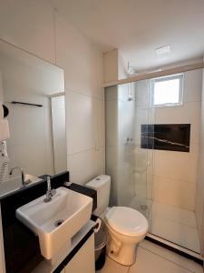 a bathroom with a sink and a toilet and a shower at Home Studio in Sobral +36 photos