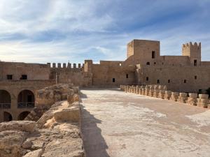 a view of a large building with a sky at Casa Madame Aïcha in Sousse