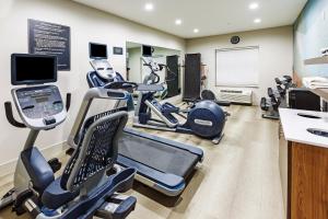 a gym with treadmills and elliptical machines at Candlewood Suites - Muskogee by IHG in Muskogee