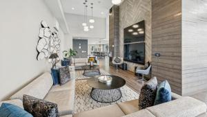 a living room with a couch and a table at Sentral SoBro in Nashville +43 photos