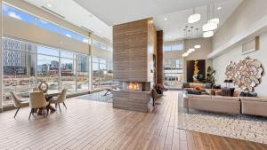 a living room with a couch and a fireplace at Sentral SoBro in Nashville