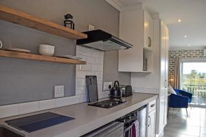 a kitchen with a stove and a counter top at 1009 Studio Apartment Pont de Val in Parys