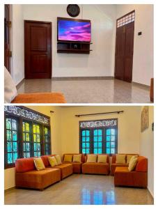 a living room with orange couches and a flat screen tv at Villa La Mama Beruwala in Beruwala