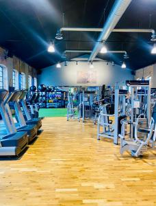 a gym with lots of treadmills and machines at Spirit Bed & Breakfast in Ekeby