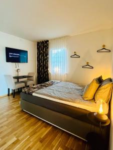 a bedroom with a bed and a table in a room at Spirit Bed & Breakfast in Ekeby