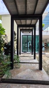 an external view of a building with glass doors at i-CONDO B2072 in Ban Liap