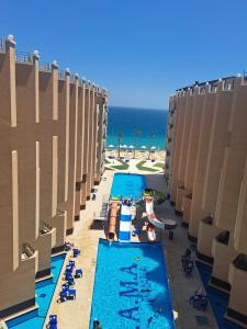 an overhead view of a swimming pool at the beach at Juliana Beach Hurghada in Hurghada