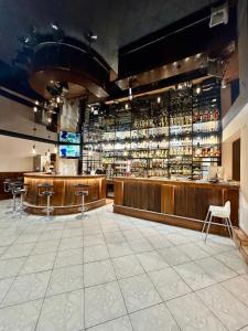 a bar with a lot of bottles of alcohol at Polonez w Rymaniu in Rymań