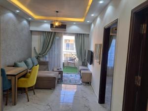 a living room with a couch and a table at Juliana Beach Hurghada in Hurghada