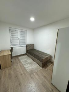 a room with a bed and a window in it at Apartman Iva in Foča