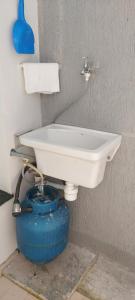a bathroom with a toilet and a sink at Casa próx ABC shopping, Pet Friendly in Santo André +55 photos