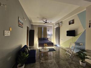 a living room with a couch and a table at OhanaStay02 in Guwahati