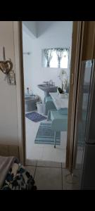 a room with a row of tables with blue chairs at Eagles guest house Piet Retief in Piet Retief +1 photo