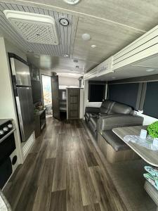 a rv living room with a couch and a table at Sunset Combate in Cabo Rojo +29 photos