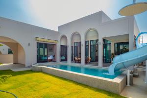 a pool in a house with a water slide at Hello Teepak A34 in Ban Bo Prakhon +15 photos
