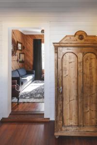 an open door to a living room with a couch at The Gilded Lady - The Cypress Suite in Pensacola