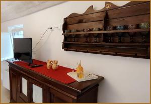 a room with a desk with a computer on it at Trulli Beauty LAMIA family pool in Martina Franca