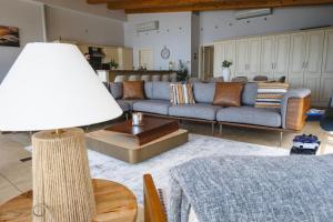 a living room with a couch and a table at Sheelin Lake House in Cavan +91 photos