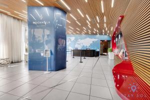 a room with a blue wall and a red car at Beachwalk Condo in Hallandale Beach +116 photos