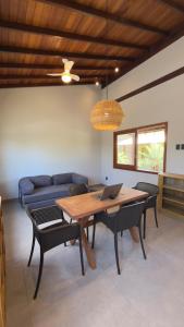 a living room with a table with a laptop on it at Villa 4 Elements, Studios Praia de Saquaíra, Maraú in Marau