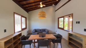 a room with a table with a laptop on it at Villa 4 Elements, Studios Praia de Saquaíra, Maraú in Marau