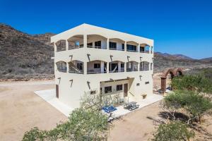 an aerial view of a white house in the desert at Pent house in Cabo Pulmo