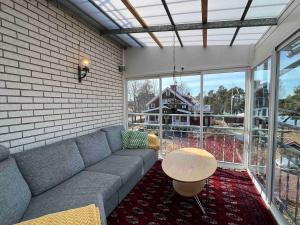 a living room with a couch and a table at Lägenhet centralt i Mora in Mora