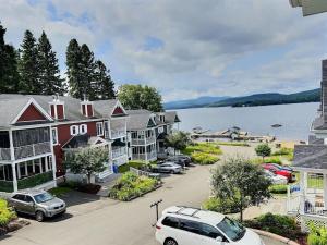 an aerial view of a town with a body of water at Condo Lac Archambault Fireplace beach in Saint-Donat-de-Montcalm