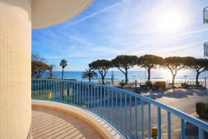 a balcony with a view of the beach and the ocean at LVG Hotel Collection - Majestic in Alassio