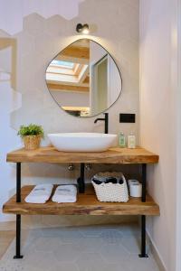 a bathroom with a sink and a mirror at Hotel Molí Cardedeu in Cardedeu +43 photos